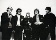 Barry Miles, left, John Dunbar, Marianne Faithfull, Peter Asher and Paul McCartney attend the opening of the Indica Gallery on Jan. 28, 1965.