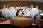Judges Stan Dietsche, left, Bill Schlinsog, John Umhoefer, executive director of the Wisconsin Cheese Makers Association, and judges Robert Aschebrock and Tim Czmowski pose for a photograph after a Gruyere by Cedric Fragniere of Switzerland won the top prize at the 2010 World Championship Cheese Contest on Thursday in Madison, Wis.