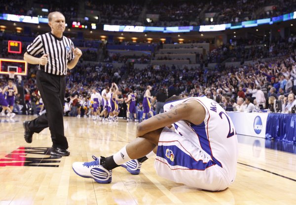 Kansas forward Marcus Morris covers his head after the Jayhawks' 69-67 loss to Northern Iowa Friday, March 20, 2010 at the Ford Center in Oklahoma City.