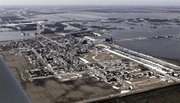The city of Halstad, Minn., is surrounded by floodwaters from the swollen Red River on Sunday north of Fargo, N.D. The river crested earlier Sunday at just under 37 feet, which is about 4 feet below the 2009 record level.