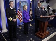 President Barack Obama, accompanied by, from left, Joint Chiefs Chairman Adm. Michael Mullen, Secretary of State Hillary Rodham Clinton and Defense Secretary Robert Gates, makes a statement on the new nuclear arms reduction treaty between the U.S. and Russia. Obama spoke Friday in the press briefing room of the White House.