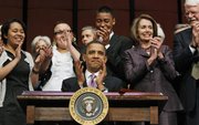 President Barack Obama applauds Tuesday after signing the Health Care and Education Reconciliation Act of 2010 with Speaker Nancy Pelosi, D-Calif, second from right, and Rep. George Miller, D-Calif, right, at the Northern Virginia Community College in Alexandria.