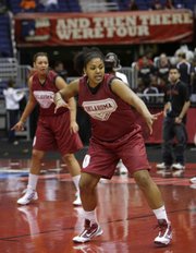 Oklahoma’s Abi Olajuwon works out during practice. The Sooners practiced Saturday for today’s semifinal against Stanford in San Antonio.