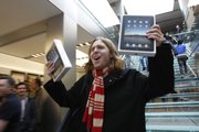 Andres Schobel holds up two iPads as one of the first customers to buy an iPad on the first day of Apple iPad sales Saturday at an Apple Store in San Francisco. Eager customers have been lining up outside Apple Stores and some Best Buys to be among the first to buy one as sales started at 9 a.m. Saturday in each time zone.