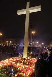 People place candles in the Pilsucki Square in Warsaw, Poland, on Saturday after Polish President Lech Kaczynski died in a plane crash.