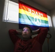 Former U.S. Marine Sgt. Joe Callan, now an organizer for the group Iraq Veterans Against The War, listens during a phone conversation March 11 in Albuquerque, N.M.