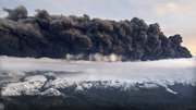 Smoke and steam hangs Wednesday over the volcano under the Eyjafjallajokull glacier in Iceland, which has erupted for the second time in less than a month, melting ice, shooting smoke and steam into the air and forcing hundreds of people to flee rising floodwaters. Volcanic ash drifting across the Atlantic forced the cancellation of flights in Britain and disrupted air traffic across northern Europe, stranding thousands of passengers.