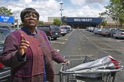 Walmart employee Betty Dukes stands Wednesday in front of a Walmart in Pittsburgh, Calif. As a “greeter,” the cheerful Betty Dukes is one of the first employees customers usually see as they walk through the front doors of the Walmart store here, but the ordained Baptist minister also is the face of the largest gender bias class action lawsuit in U.S. history, Dukes v. Wal-Mart.