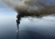 An oil slick is seen as the Deepwater Horizon oil rig burns in this aerial file photo taken April 21 in the Gulf of Mexico, more than 50 miles southeast of Venice on Louisiana’s tip. In the coming days images of fouled beaches and dying wildlife, damaged coastal economies and more could complicate plans to open federal waters to drilling.