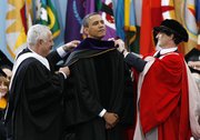 President Barack Obama receives an honorary law degree Saturday at the University of Michigan in Ann Arbor.