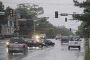 Drivers carefully proceed through the intersection of Ninth and Tennessee Streets, Monday, May 10, 2010 as traffic lights downtown were out because of a power outage. The power failures were confined primarily to the area north and east of 23rd and Iowa Streets.
