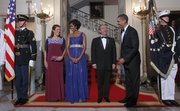 President Barack Obama and first lady Michelle Obama, with Mexican President Felipe Calderon and his wife Margarita Zavala, pose for the group photo Wednesday at the Grand Staircase before the start of the State Dinner at the White House in Washington.