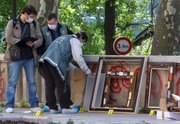 Police officers search for clues as they pack up the frames of the stolen paintings outside the Paris Museum of Modern Art, following the report of five paintings having been stolen Thursday. Police and prosecutors say a lone thief has stolen five paintings worth a total of $123 million, including works by Pablo Picasso and Henri Matisse.