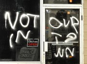 “NOT IN OUR TOWN” is spray-painted on a medical marijuana business May 10 in Billings, Mont. Billings Police and Fire Departments are also investigating firebombs at two medical marijuana businesses.