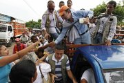 Santos greets supporters from the back of a truck during a campaign rally Thursday in Fundacion, northern Colombia. Colombia will hold presidential elections on May 30.