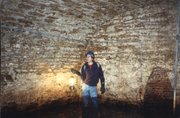 Free State Brewery's master brewer, Steve Bradt, during a 1997 expedition in the old Walruff Brewery tunnels — the first time people had explored them since they were sealed in 1964.