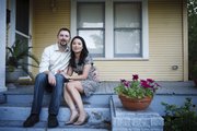 Married for 7 months, Hai Nguyen, 37, and her husband, Jon Pope, 37, sit outside their home in Houston on Tuesday. They are part of a slowing trend of inter-ethnic marriage.
