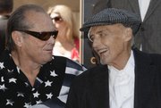 Actor Jack Nicholson, left, congratulates Dennis Hopper after Hopper was honored with a star on the Hollywood Walk of Fame on March 26 in Los Angeles.