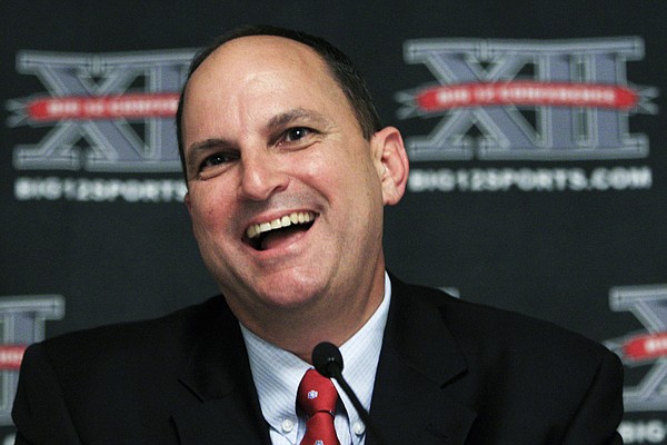 Oklahoma athletic director Joe Castiglione talks with reporters during the Big 12 meetings Thursday in Kansas City, Mo. 