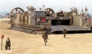 Marines race onto the beach from an amphibious landing craft during a mock invasion of Red Beach at Camp Pendleton Marine Corps Base in this 1999 file photo.
