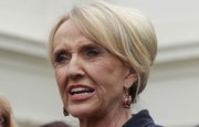 Arizona Gov. Jan Brewer speaks to reporters Thursday outside the White House in Washington after a private meeting with President Barack Obama.