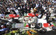 Mourners pray by the coffins of victims of the Israeli naval commando raid Thursday as they are carried at the end of the religious funeral service at the Fatih mosque in Istanbul, Turkey. In a stunning reversal that illustrated the severity of the diplomatic fallout from its bloody raid on a Gaza-bound flotilla, Israel dropped plans to prosecute dozens of the captured pro-Palestinian activists, moving instead to deport all of them quickly.