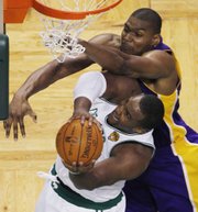 Boston forward Glen Davis, front, shoots against Lakers center Andrew Bynum in the fourth quarter of Game 3 of the NBA finals. The Lakers won, 91-84, Tuesday in Boston.