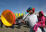 A soccer fan blows a plastic trumpet known as a vuvuzela Saturday in Kimberley, South Africa. Nothing represents the sheer exuberance of South African soccer fans better than the “vuvuzela,” the trombone-length plastic horn that will be heard in force starting Friday at the World Cup.