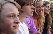 Kris Sonnenberg, 38, right, sits with her children, from left, Mike, 8; Charlie, 12; and Elise, 17, in their backyard May 25 in Chicago. Kris is considered a member of Generation X, and Elise is Generation Y. Mike and Charlie may end up being a member of Generation Z, depending on how the youngest generation alive now will be defined.