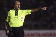 Referee Carlos Simon gestures during a Copa Libertadores soccer game between Peru’s Alianza Lima and Peru’s Juan Aurich in Chiclayo, Peru, in this March 16 file photo. The Brazilian referee and his assistants who will work the England-United States match at the World Cup have been studying English-language obscenities the players might use. Carlos Simon will referee Saturday's match in Rustenburg, assisted by Roberto Braatz and Altemir Hausmann. They want to ensure players can't get away with abuse. “We have to learn what kind of words the players say,” Hausmann told Brazilian broadcaster Globo Sport. “All players swear and we know we will hear a few.”