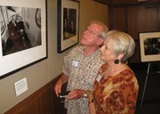 Jacqueline and Larry Gadt, Lawrence, study photojournalist Melina Mara’s picture of Sens. Elizabeth and Bob Dole riding the U.S. Senate subway together. The exhibit “Changing the Face of Power: Women in the U.S. Senate” opened Friday and runs through July 21.