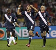United States’ Clint Dempsey, center, celebrates after scoring a goal in the World Cup Group C soccer match
against England. The two squads tied, 1-1, on Saturday in Rustenburg, South Africa.