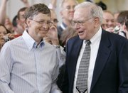 Microsoft co-founder Bill Gates, left, and billionaire investor Warren Buffett are seen during the annual Berkshire Hathaway shareholders meeting May 6, 2007, in Omaha, Neb. Gates and Buffett are launching a campaign to get other American billionaires to give at least half their wealth to charity.