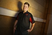 Christopher Barton, 31, of Boulder City, Nev., first tried Rentafriend about six months ago during a business trip training clients for an online university. Spending more than a week on the road on average every month, he hates to eat alone in restaurants and wants to make the most of his downtime. He is pictured on the Las Vegas Strip on Monday.