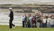 Tiger Woods, left, walks along the fourth hole during the second round of the U.S. Open on Friday at Pebble Beach, Calif.