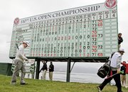Tom Watson walks off the 18th hole after his second round of the U.S. Open on Friday at Pebble Beach, Calif.