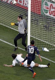 Landon Donovan (10) of the United States scores a goal against Slovenia. The Americans tied Slovenia, 2-2, on Friday at the World Cup in Johannesburg.