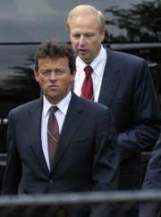 BP Chief Executive Officer Tony Hayward, left, and BP Managing Director Bob Dudley, right, arrive with other BP executives at the White House in Washington in this June 16 file photo.