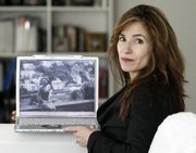 Alexandra Drane shows a picture of her sister-in-law Rosaria Vandenberg at her Winchester, Mass., home. After watching her sister-in-law lose a battle with cancer in the hospital, Drane created a website to help support people’s options to spend their final days at home instead.