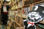 Radio personality Barret Hansen, known on the airwaves as “Dr. Demento,” walks inside his record collection at his home studio in Lakewood, Calif. After nearly 40 years of broadcasting catchy little tunes celebrating everything from dogs getting run over by lawnmowers to cockroaches devouring entire cities, Dr. Demento is discontinuing his syndicated radio show but will continue broadcasting on the Web.