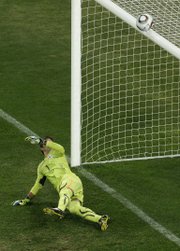 Uruguay keeper Fernando Muslera looks up to see a penalty kick by Ghana’s Asamoah Gyan hit the bar during their World Cup quarterfinal. Uruguay won the 1-all draw with a 4-2 penalty-kick shootout on Friday in Johannesburg.