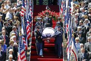 The honor guard carries the casket of the Sen. Robert Byrd down the steps during a memorial service Friday at the State Capitol in Charleston, W.Va.