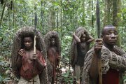 Mbuti pygmy men, from left, Faizi Malambi, Kawaya Situka, Besei, and Kange Ambali carry their hunting nets and spears as they await the start of the day’s hunt March 18 in the Okapi Wildlife Reserve outside the town of Epulu, Congo. The pygmies traditional practice of hunting bushmeat has devolved into an all-out commercial endeavor, staged not for subsistence, but to feed growing regional markets. The result: the forests, those that remain, are growing emptier by the day.