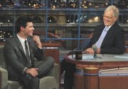 Taylor Lautner, left, who stars in “The Twilight Saga: Eclipse,” joins host David Letterman on the set of the “Late Show with David Letterman” on June 30 in New York.