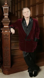 Playboy founder Hugh Hefner is photographed at the Playboy Mansion in the Holmby Hills area of Los Angeles in this April 2006 file photo. Hefner is offering to buy the remaining shares of the media empire he founded in the 1950s.