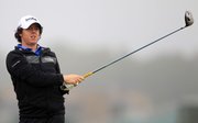 Northern Ireland’s Rory McIlroy watches his third tee shot during the first round of the British Open. McIlroy shot a 63 to take the lead after the first round Thursday at St. Andrews, Scotland.