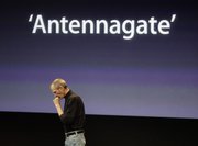 Apple CEO Steve Jobs talks about the Apple iPhone 4 at Apple headquarters in Cupertino, Calif., on Friday.