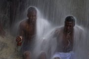 Voodoo pilgrims bathe in a waterfall believed to have purifying powers Friday during an annual celebration in Saut d’Eau, Haiti. The annual pilgrimage to Saut d’Eau venerates the site where believers say the Virgin Mary, whom many here revere as the goddess of love, Ezili Danto, once appeared.