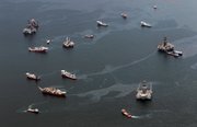 Drilling rigs and workboats operate Friday at the site of the Deepwater Horizon incident in the Gulf of Mexico. The wellhead has been capped and BP is continuing to test the integrity of the well before resuming production.