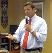 Kris Kobach, a Republican running for Kansas secretary of state, answers questions during a forum in this July 22 photo at the Tallgrass Creek retirement center in Overland Park, Kan. Kobach says President Barack Obama could resolve questions surrounding his citizenship by releasing a detailed birth certificate.